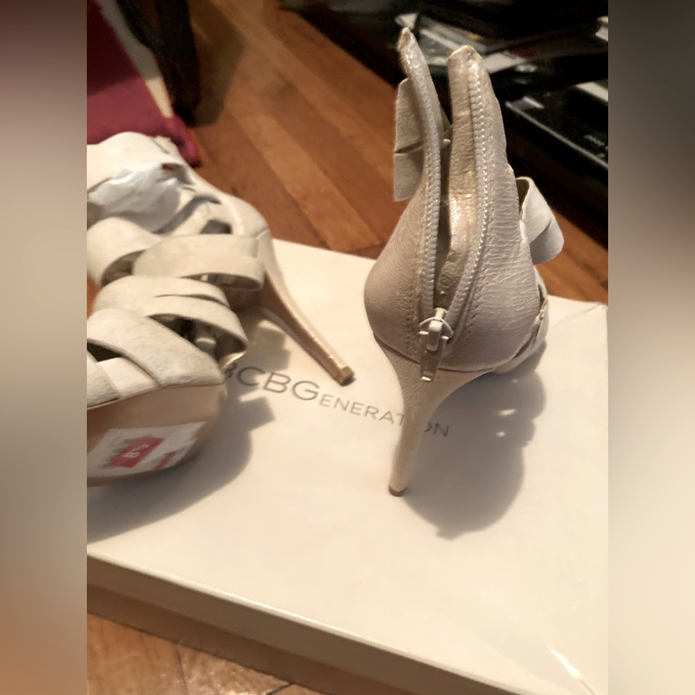 beige colored high -heeled shoes. New and never worn. Size 8 1/2. 3in heels.
